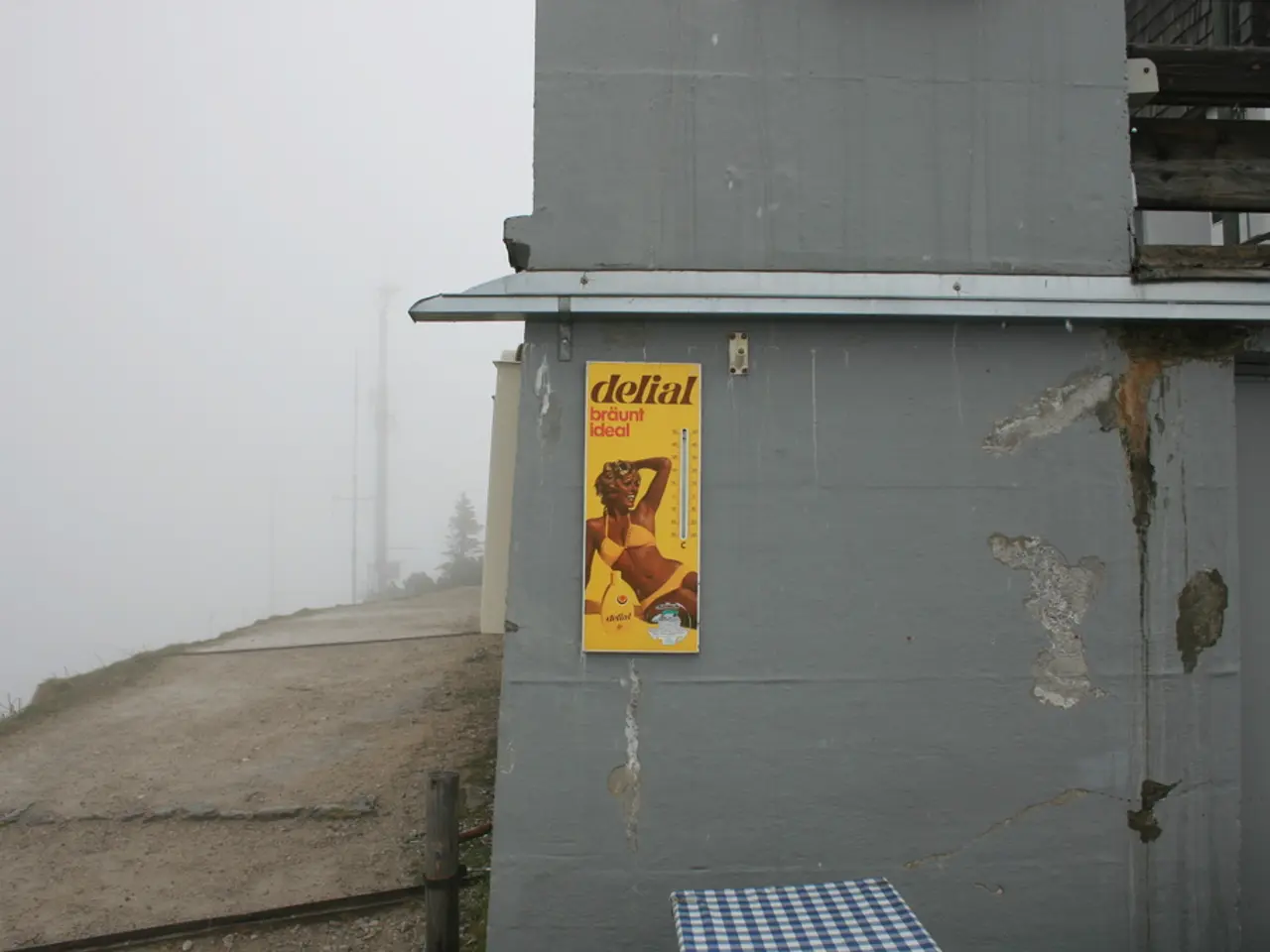 In the foreground of this image, on the right, there is a wall and a poster on it. On the bottom,...