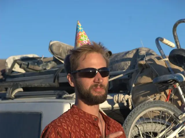 Wrap-around sunglasses by Oakley, covering both eyes and nose for a protective design.