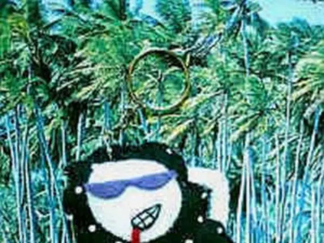 This is an edited image in this image there is a keychain, in the background there are trees and a...