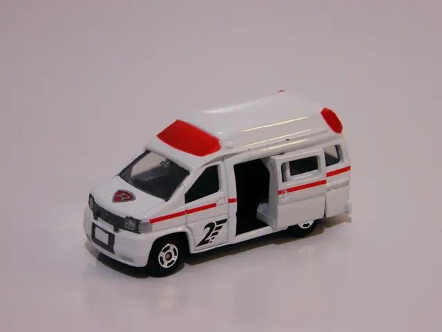 In this picture there is a toy vehicle and at the bottom there is a floor and there is a reflection...