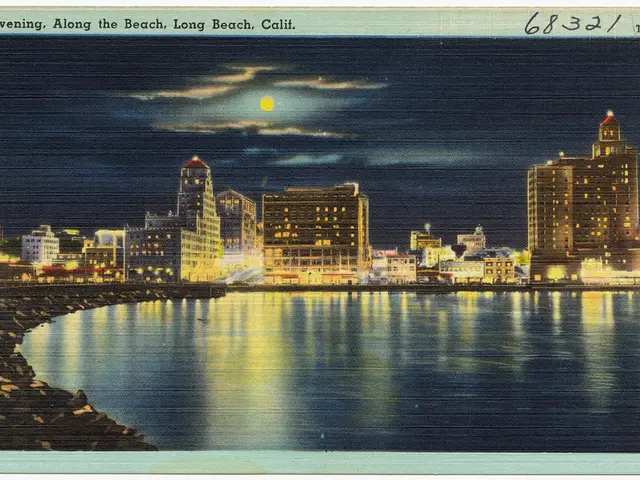 In this picture we can see a photo of buildings, water, rocks, lights and sky. At the top and...