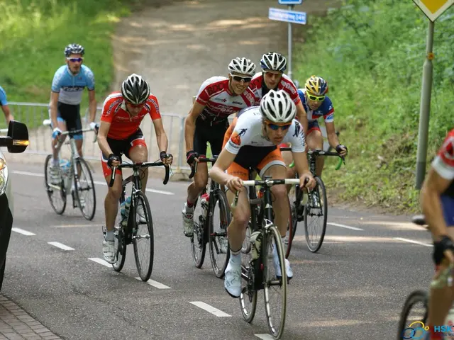 In this image there are few people riding a bicycle. On the left side there is a car. In the...