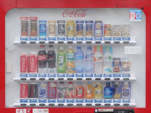 There is a fridge. There are number of bottles in it. The fridge has a sticker. The fridge has a...