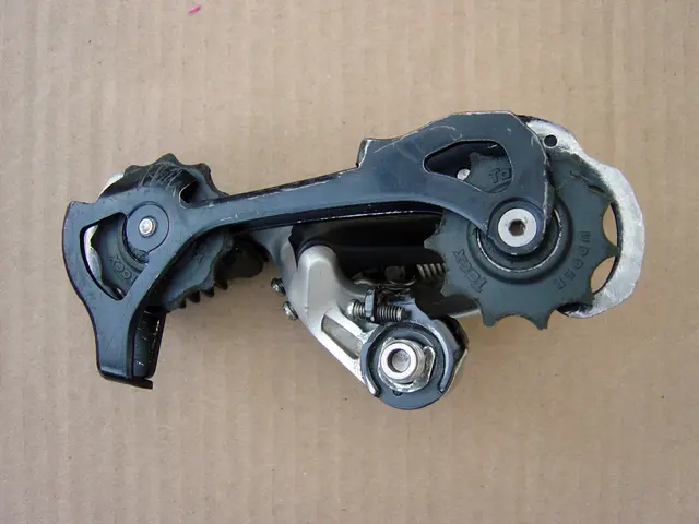 The picture consists of an instrument looking like a gear or a tool on a cardboard sheet.