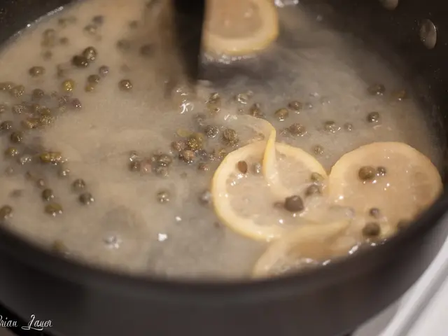 This image looks like a soup in the bowl and they are lemon slices.