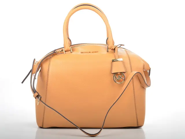 This is a leather handbag which is yellow in color. It has a long handle and short handles. This is...