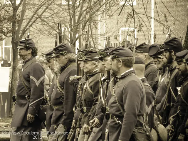 In this picture I can observe some men walking on the road. There is a watermark on the bottom left...