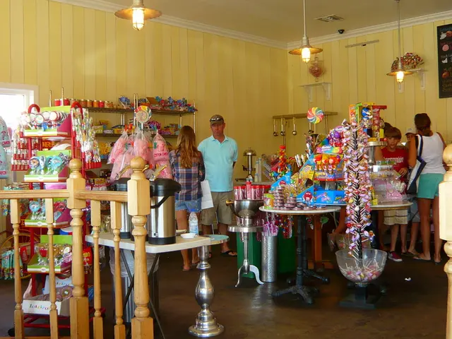 In the image we can see there are people standing and there is a shop in which there are lollipops,...