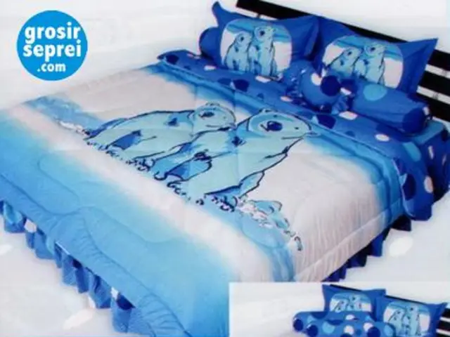 In this picture there is a bed with two pillow and blanket